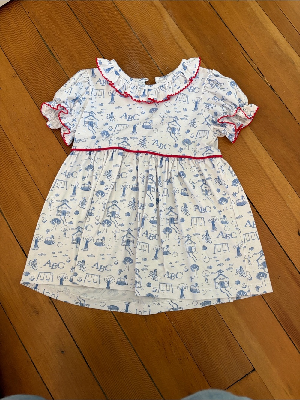 Girls White & Light Blue ABC Print Ruffle shirt with red Trim